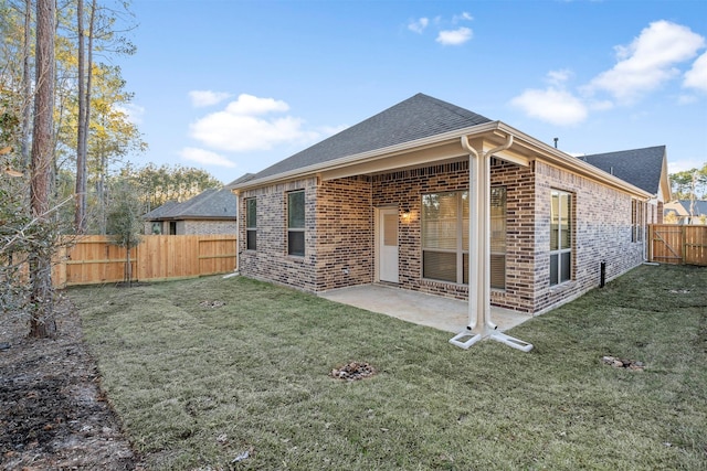 119 Lukewood Cir, Conroe, TX 77318 - rear view of property featuring brick siding, a shingled roof, and a patio area