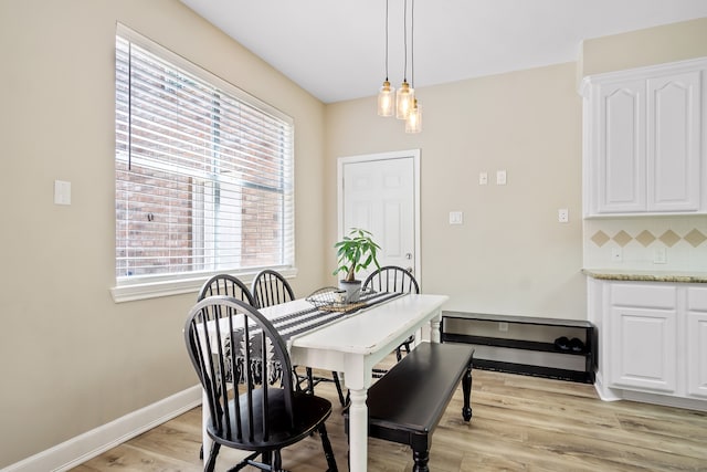 3006 Pecan Way Ct, Richmond, TX 77406 - dining room with light wood-style flooring, healthy amount of natural light, and baseboards