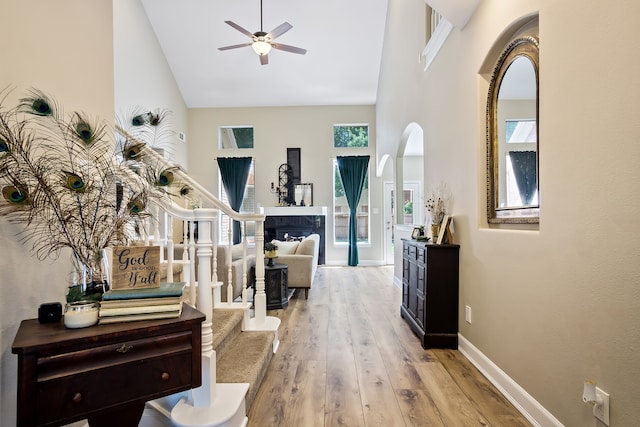 3006 Pecan Way Ct, Richmond, TX 77406 - corridor featuring high vaulted ceiling, wood finished floors, baseboards, and arched walkways