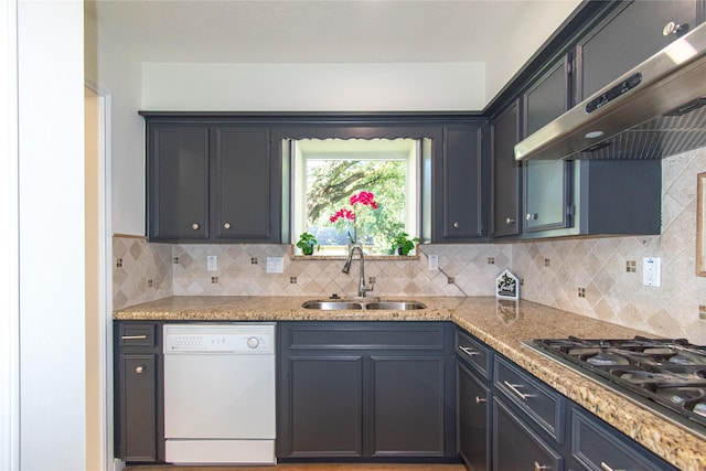 822 Red Rock Canyon Dr, Katy, TX 77450 - kitchen featuring white dishwasher, range hood, stainless steel gas stovetop, and backsplash