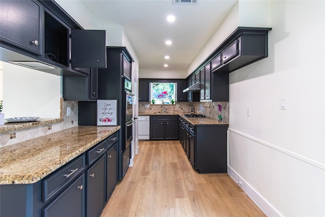 822 Red Rock Canyon Dr, Katy, TX 77450 - kitchen featuring light wood-type flooring, wainscoting, decorative backsplash, white dishwasher, and recessed lighting