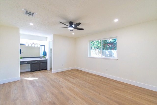822 Red Rock Canyon Dr, Katy, TX 77450 - unfurnished bedroom featuring light wood-style flooring, recessed lighting, ensuite bath, and ceiling fan