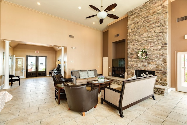 7000 Seawall Blvd Unit 831, Galveston, TX 77551 - living area with ceiling fan, crown molding, a towering ceiling, plenty of natural light, and light tile patterned flooring