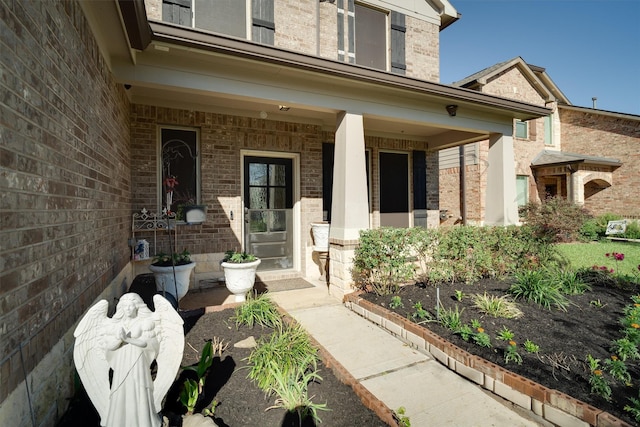 2715 Wembley Way, Rosenberg, TX 77471 - entrance to property with brick siding and a porch