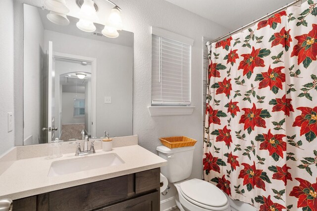 2715 Wembley Way, Rosenberg, TX 77471 - bathroom featuring vanity, toilet, and a shower with shower curtain