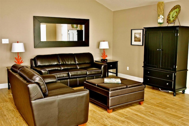 13015 Gulf Beach Dr, Freeport, TX 77541 - living room featuring light wood-style flooring and baseboards