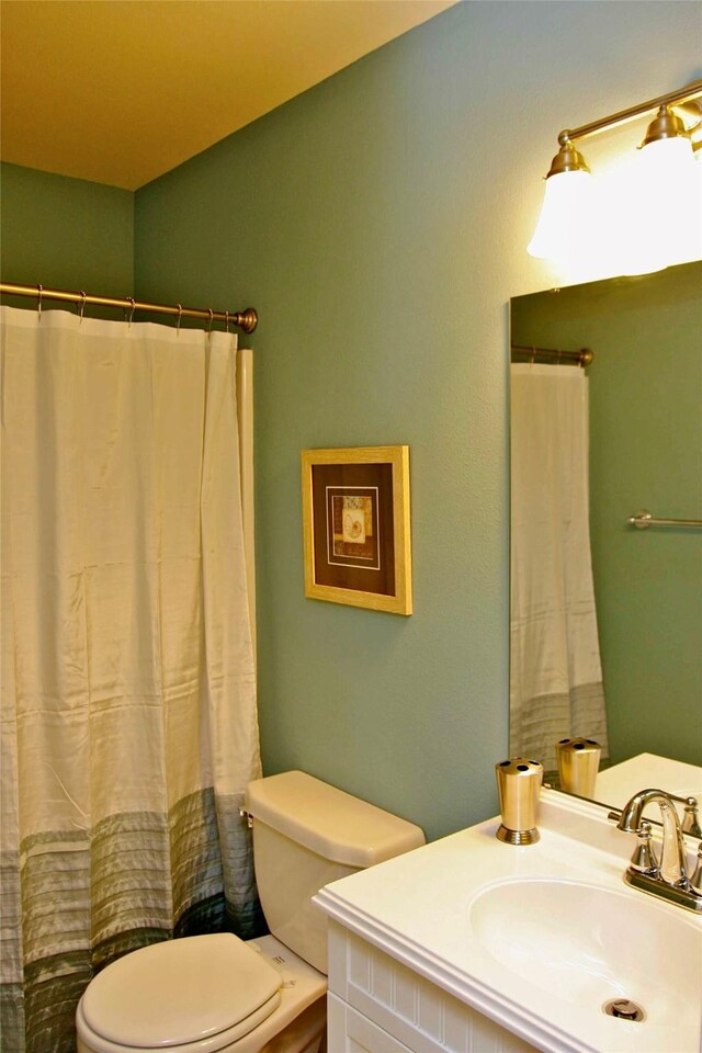 13015 Gulf Beach Dr, Freeport, TX 77541 - bathroom featuring toilet and vanity