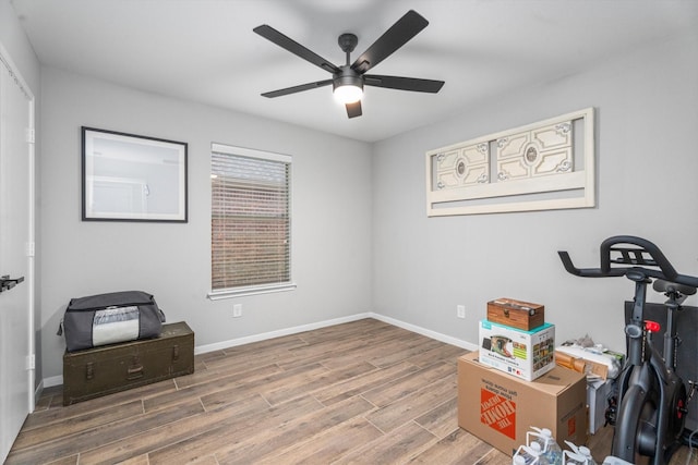 21343 Slate Crossing Ln, Katy, TX 77449 - exercise room featuring wood finished floors, a ceiling fan, and baseboards
