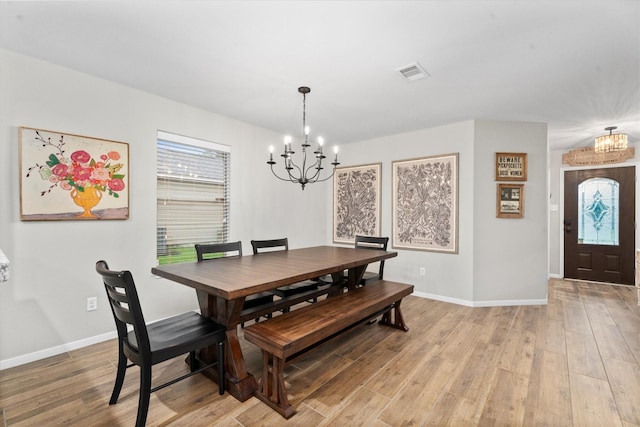 21343 Slate Crossing Ln, Katy, TX 77449 - dining room with a chandelier, light wood-style floors, plenty of natural light, and baseboards