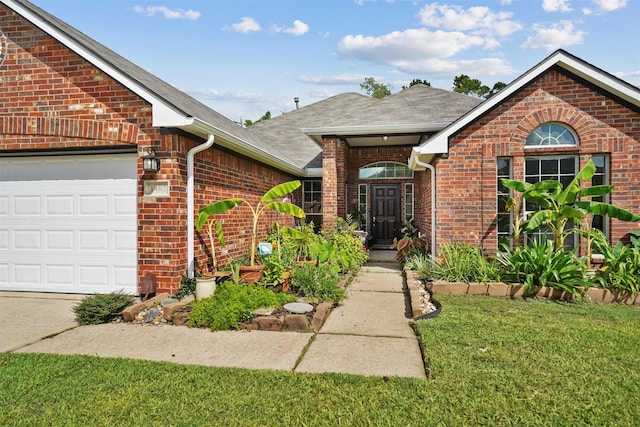 1497 Allison St, Alvin, TX 77511 - view of front of home featuring brick siding, roof with shingles, a front lawn, and a garage