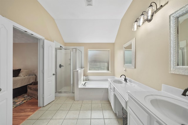 1497 Allison St, Alvin, TX 77511 - bathroom featuring a bath, lofted ceiling, a shower stall, double vanity, and connected bathroom