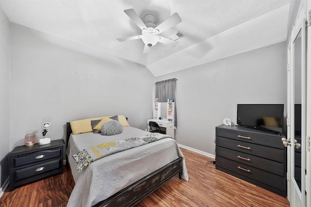 1497 Allison St, Alvin, TX 77511 - bedroom featuring baseboards, wood finished floors, a textured ceiling, and ceiling fan