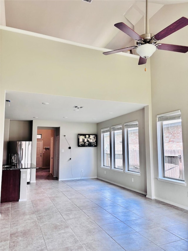 5130 Klein Orchard Dr, Houston, TX 77066 - unfurnished living room featuring light tile patterned flooring, high vaulted ceiling, baseboards, and a ceiling fan