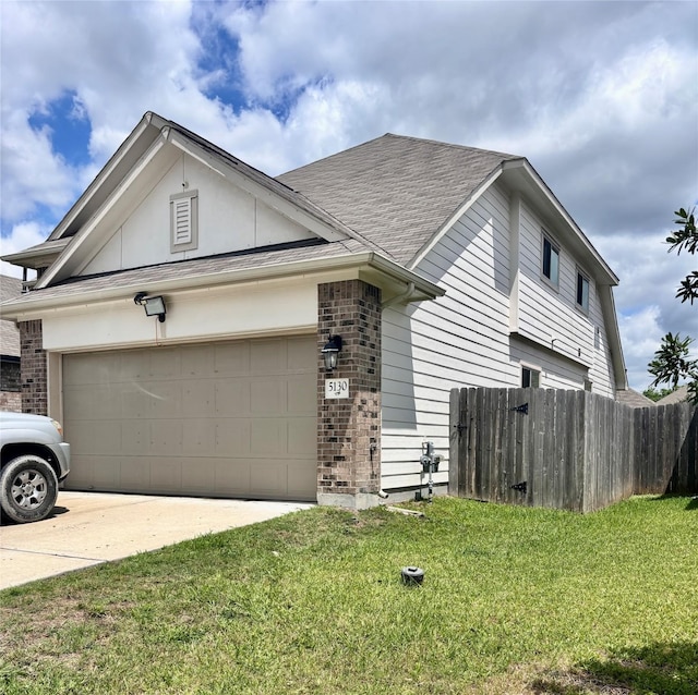5130 Klein Orchard Dr, Houston, TX 77066 - view of front facade with brick siding, an attached garage, driveway, and a shingled roof