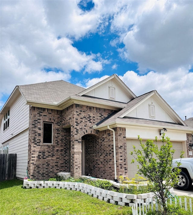 5130 Klein Orchard Dr, Houston, TX 77066 - view of front of home featuring brick siding, an attached garage, and a shingled roof