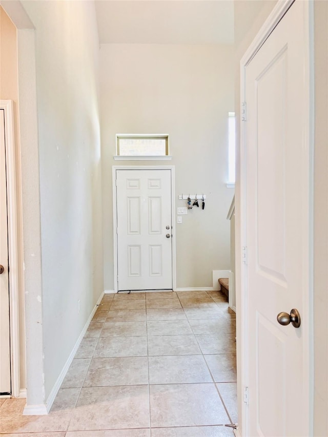 5130 Klein Orchard Dr, Houston, TX 77066 - foyer with light tile patterned floors, baseboards, and stairs