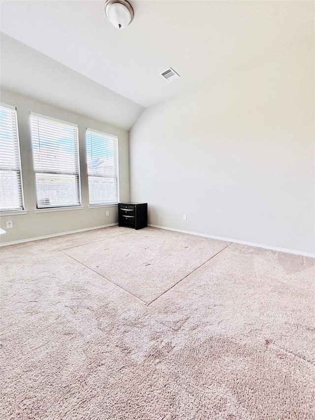 5130 Klein Orchard Dr, Houston, TX 77066 - unfurnished living room with lofted ceiling, baseboards, and carpet floors