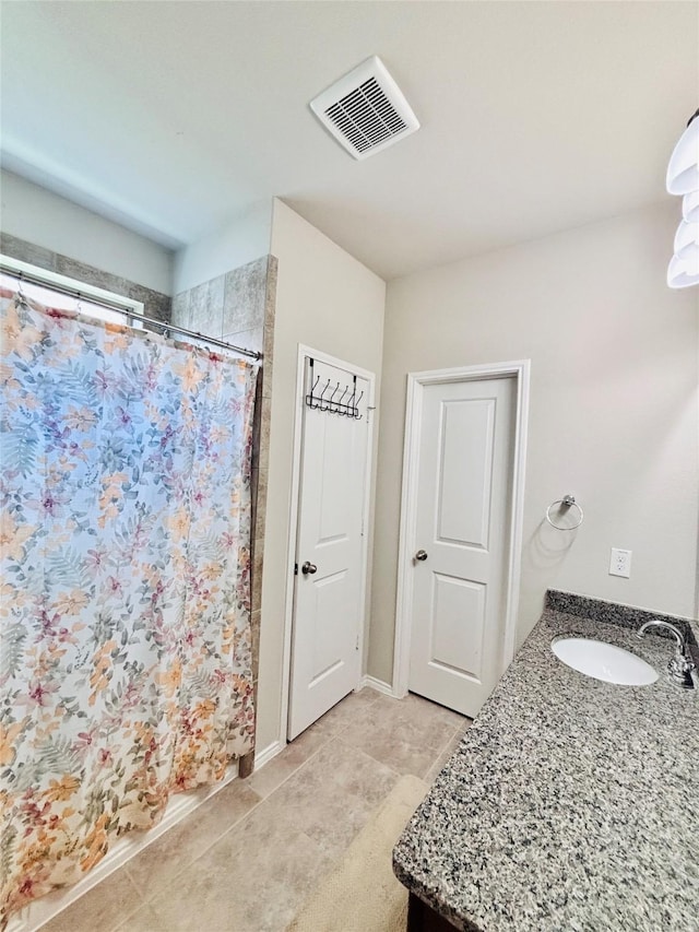 5130 Klein Orchard Dr, Houston, TX 77066 - full bathroom with tile patterned floors, vanity, and a shower with shower curtain