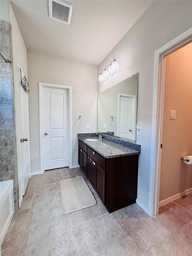 5130 Klein Orchard Dr, Houston, TX 77066 - bathroom with vanity, tile patterned floors, and baseboards