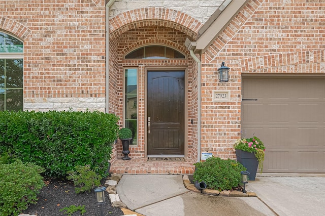 27923 Coulter Dr, Spring, TX 77386 - entrance to property with brick siding and a garage