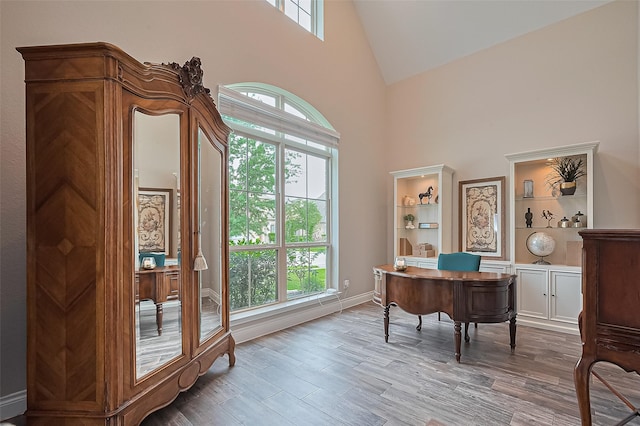 27923 Coulter Dr, Spring, TX 77386 - office area featuring high vaulted ceiling and wood finished floors
