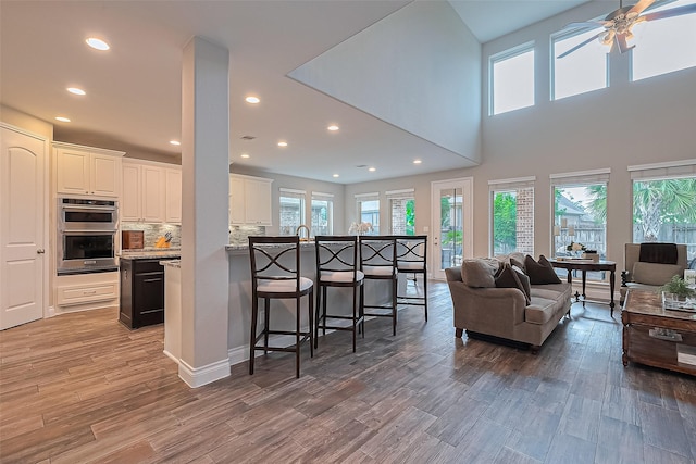 27923 Coulter Dr, Spring, TX 77386 - living room with light wood-type flooring, ceiling fan, and recessed lighting