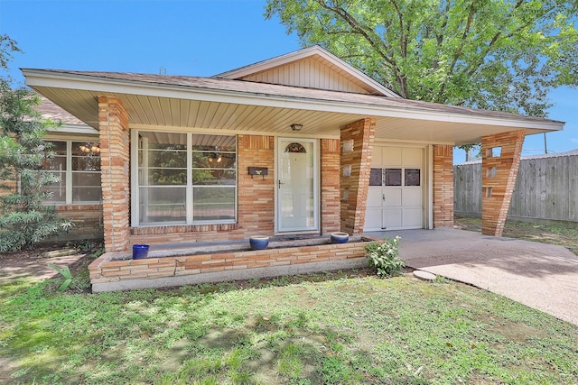 3919 Gardendale Dr, Houston, TX 77092 - view of front of property featuring driveway, an attached garage, covered porch, and brick siding
