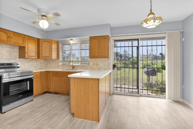 3919 Gardendale Dr, Houston, TX 77092 - kitchen with electric stove, a sink, light wood-style flooring, and light countertops