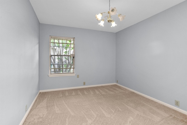 3919 Gardendale Dr, Houston, TX 77092 - carpeted empty room featuring a chandelier and baseboards