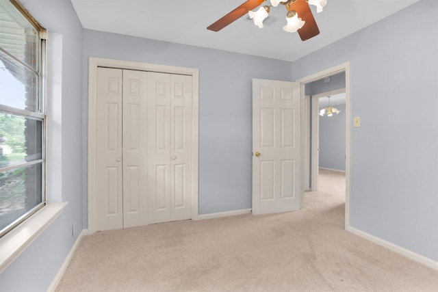 3919 Gardendale Dr, Houston, TX 77092 - unfurnished bedroom featuring carpet flooring, a closet, baseboards, and a ceiling fan