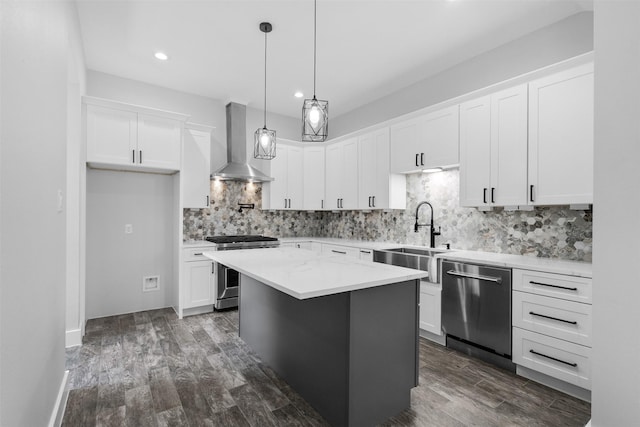 6613 Ave O, Houston, TX 77011 - kitchen featuring extractor fan, appliances with stainless steel finishes, backsplash, dark wood-style flooring, and recessed lighting