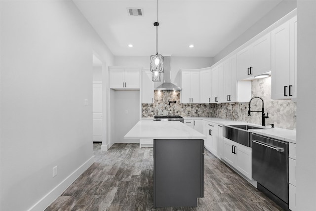 6613 Ave O, Houston, TX 77011 - kitchen featuring stainless steel dishwasher, wall chimney exhaust hood, tasteful backsplash, white cabinets, and range