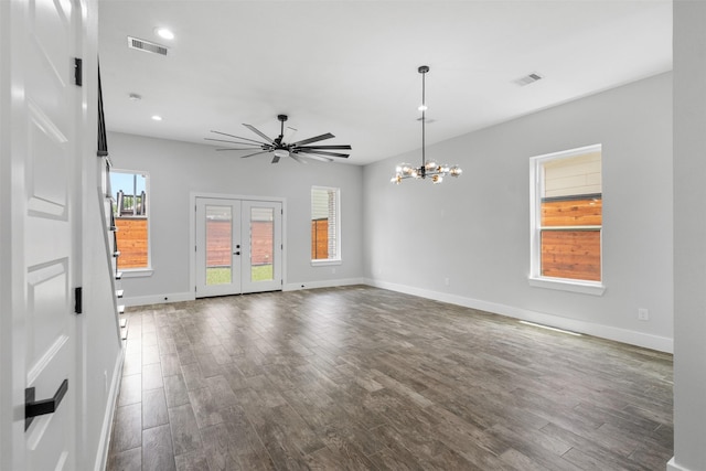 6613 Ave O, Houston, TX 77011 - unfurnished living room featuring dark wood finished floors, a chandelier, recessed lighting, a ceiling fan, and french doors