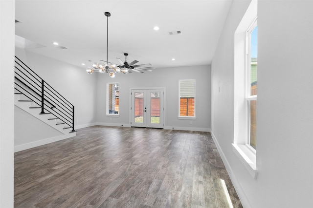 6613 Ave O, Houston, TX 77011 - unfurnished living room featuring plenty of natural light, recessed lighting, stairway, wood finished floors, and a chandelier