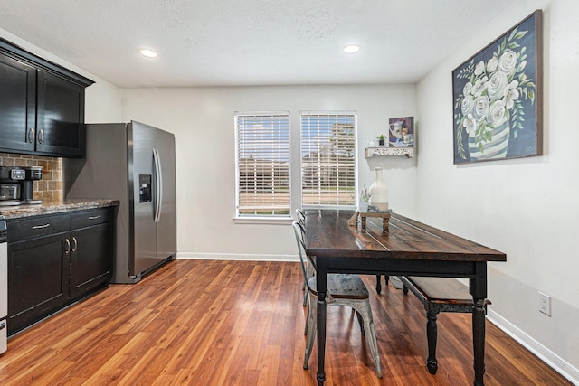 10922 Graywood Ct, La Porte, TX 77571 - dining area featuring wood finished floors, baseboards, and recessed lighting