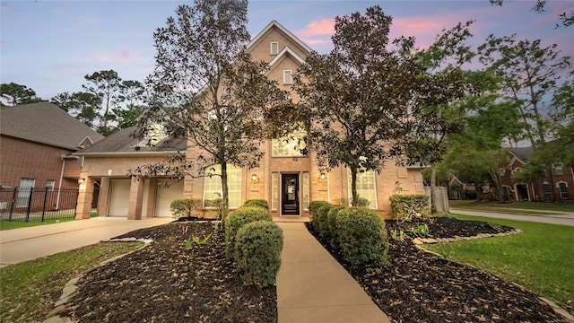 9710 Sotherloch Lake Dr, Spring, TX 77379 - view of front facade featuring brick siding, driveway, and an attached garage