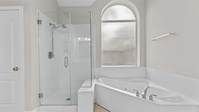9710 Sotherloch Lake Dr, Spring, TX 77379 - full bathroom with a stall shower and a whirlpool tub