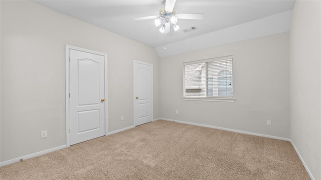 9710 Sotherloch Lake Dr, Spring, TX 77379 - unfurnished bedroom with carpet flooring, baseboards, and ceiling fan