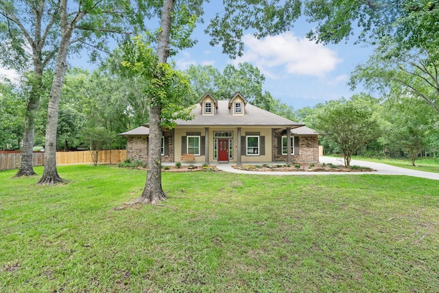 11710 Creek View Ln, Conroe, TX 77385 - view of front of property with brick siding, covered porch, and roof with shingles