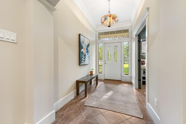 11710 Creek View Ln, Conroe, TX 77385 - foyer with ornamental molding, dark tile patterned floors, and baseboards
