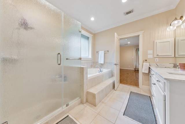11710 Creek View Ln, Conroe, TX 77385 - bathroom featuring tile patterned floors, double vanity, a bath, a stall shower, and ornamental molding