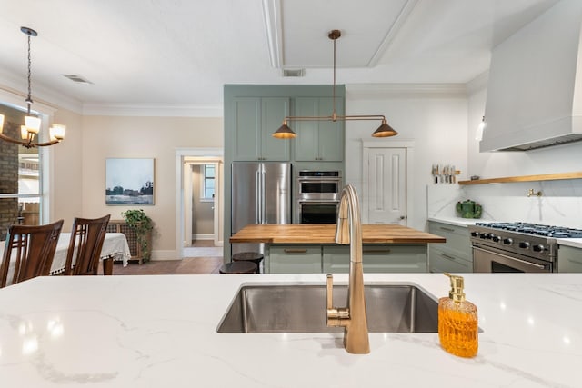 11710 Creek View Ln, Conroe, TX 77385 - kitchen featuring stainless steel appliances, wood counters, premium range hood, a sink, and crown molding