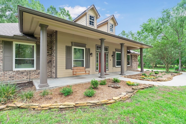 11710 Creek View Ln, Conroe, TX 77385 - view of front of home with covered porch and brick siding