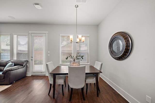 2027 Tarfite Pl, Houston, TX 77077 - dining space featuring a chandelier, dark wood-type flooring, and baseboards