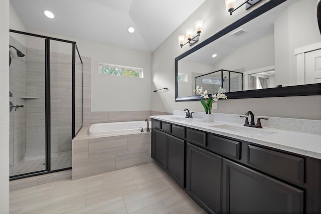 2027 Tarfite Pl, Houston, TX 77077 - full bath with vaulted ceiling, a bath, double vanity, a stall shower, and recessed lighting
