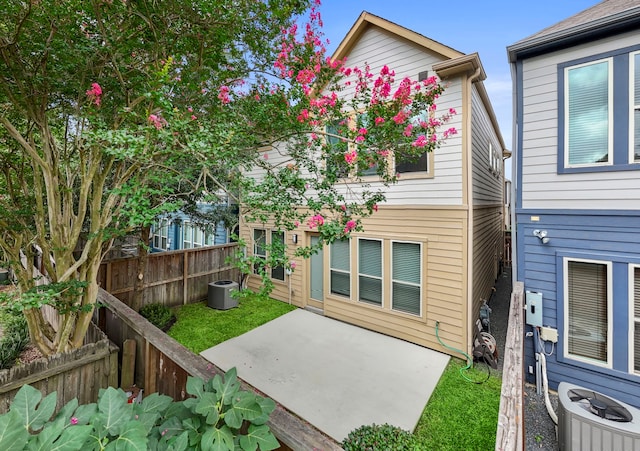 2027 Tarfite Pl, Houston, TX 77077 - rear view of house featuring central air condition unit, a patio, and a fenced backyard