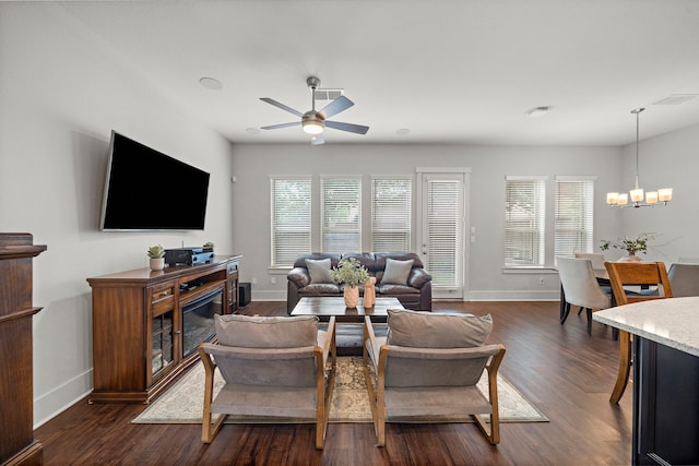 2027 Tarfite Pl, Houston, TX 77077 - living room featuring ceiling fan, dark wood-style floors, plenty of natural light, and baseboards