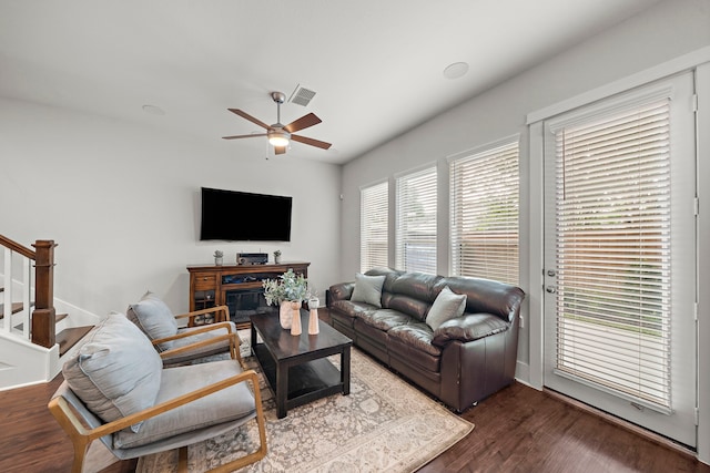2027 Tarfite Pl, Houston, TX 77077 - living room with ceiling fan, stairway, and wood finished floors