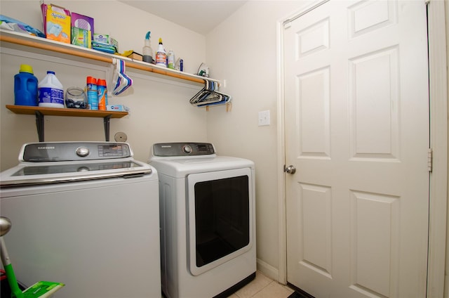 9414 Emerald Green Dr, Rosharon, TX 77583 - laundry room with washing machine and clothes dryer and light tile patterned floors