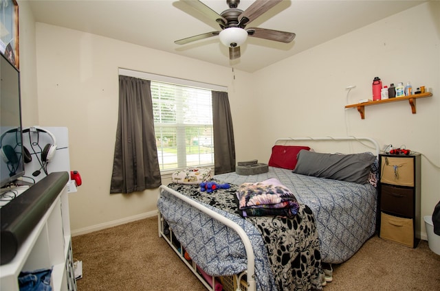 9414 Emerald Green Dr, Rosharon, TX 77583 - carpeted bedroom with a ceiling fan and baseboards